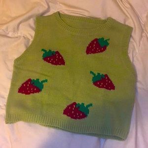 Women’s Xs green strawberry sweater vest, slightly cropped.